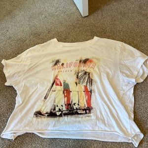 Oversized t shirt, kind of cropped, never worn. Size XL, super cute